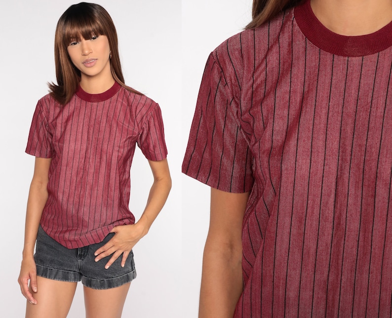 May include: A red striped short-sleeved t-shirt with a crew neck.