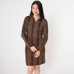 May include: A brown and gray striped long-sleeved dress with a collared neckline.