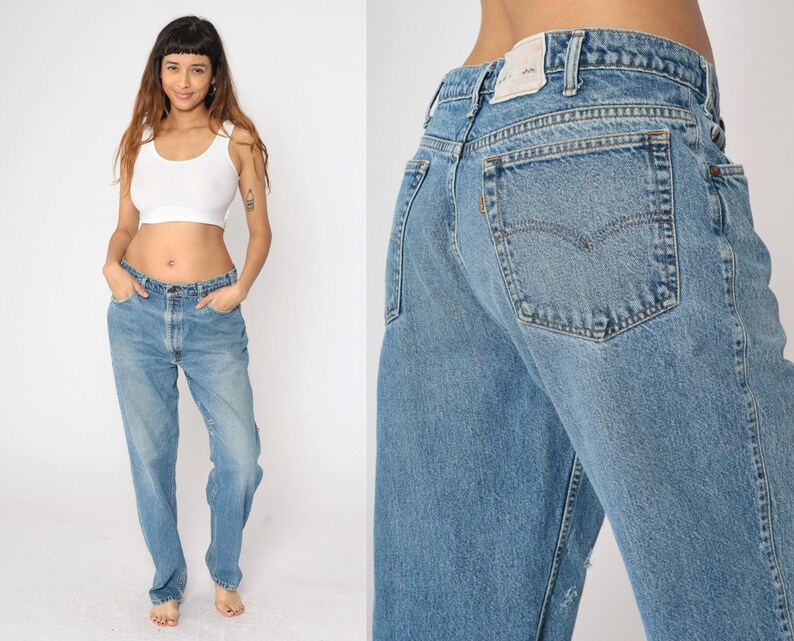 May include: A pair of light blue denim jeans with a high waist and a straight leg. The jeans have a faded look and are made of a soft, comfortable fabric.