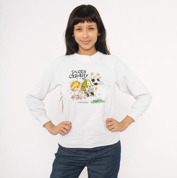 Soccer Casualty Sweatshirt 90s Cartoon Graphic Raglan Sleeve White Cotton Pullover Novelty Funny Sports Humor Vintage Sweater Extra Small XS