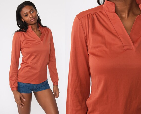 orange v neck long sleeve shirt