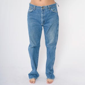 May include: A pair of light blue denim jeans with a straight leg fit.