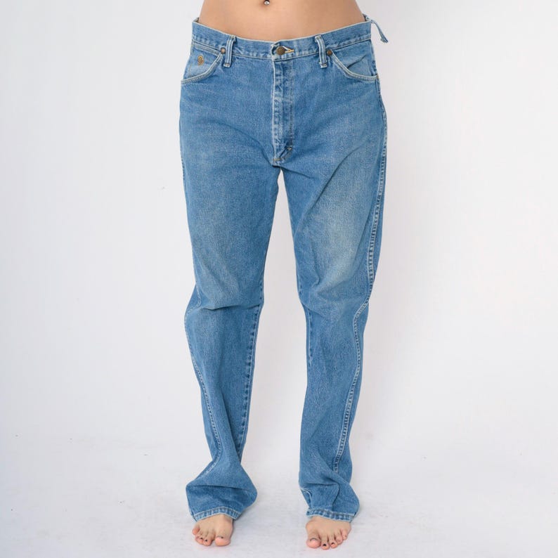 May include: A pair of light blue denim jeans with a straight leg fit.