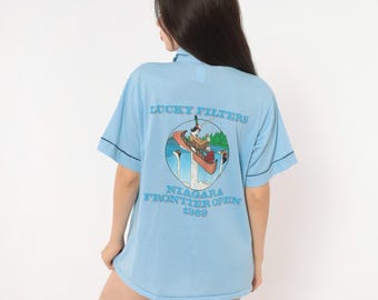 80s Cigarette Light Blue Polo Shirt Niagara 1989 Canoe Graphic Short Sleeve Navy Trim Boxy Novelty Tournament Tee Sports Unisex Medium M
