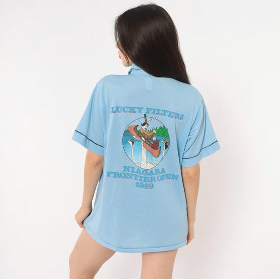 80s Cigarette Light Blue Polo Shirt Niagara 1989 Canoe Graphic Short Sleeve Navy Trim Boxy Novelty Tournament Tee Sports Unisex Medium M