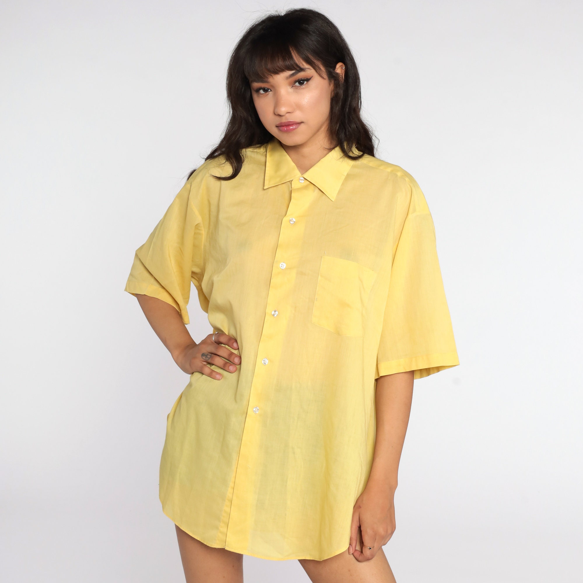 yellow button up shirt