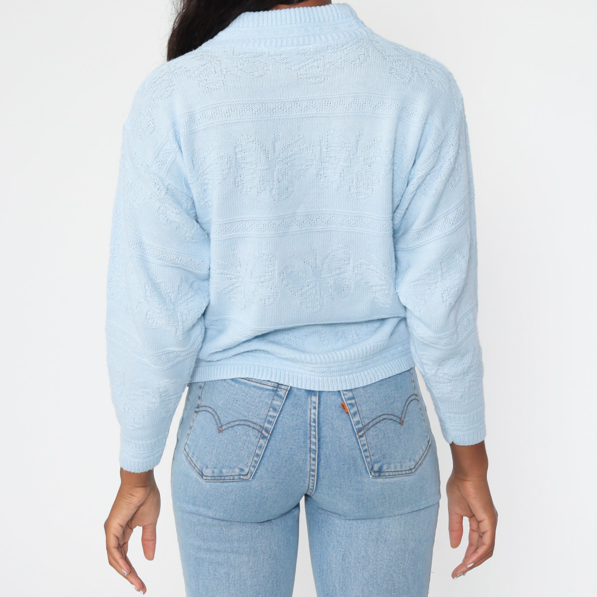 white sweater with blue butterfly