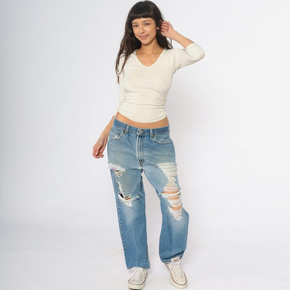 Distressed 550 Levis Jeans Y2K Light Wash Denim Ripped Destroyed Holes Relaxed Fit Grunge 90s Baggy Blue Vintage Casual Pants 34 x 29