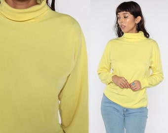 yellow turtleneck top