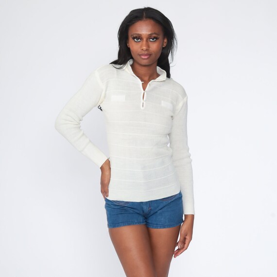 tight white sweater