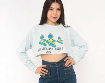 Run Against Crime 1989 Distressed Cropped Long Sleeve Tee Cartoon Turtle Police Cotton Crop Top Baby Blue Graphic 80s Novelty Shirt Medium M