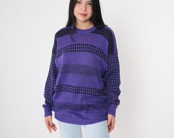 May include: A purple and black striped sweater with a textured pattern. The sweater has a crew neck and long sleeves.
