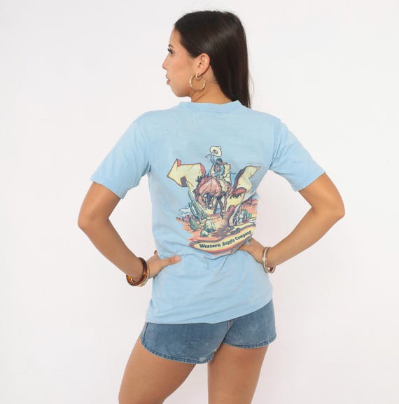 90s Cowboy Graphic Tee Light Blue Pocket T Shirt Cotton Western Rodeo Bronco Horse Desert Cactus Print Short Sleeve Unisex Small S