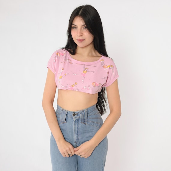 Vintage Track and Field Crop Top 80s Pink Graphic Tee 1980s Sports Cartoon Print T-Shirt Short Sleeve Raw Cropped Hem Athletic Small S
