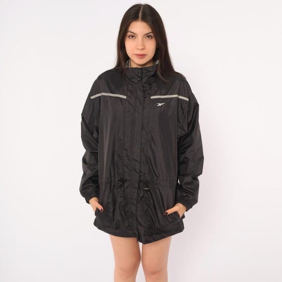 90s Reebok Windbreaker Jacket Black Drawstring Waist Reflective Stripe Long Sleeve Grey Sporty Athletic Gorpcore Coat Vintage Medium M
