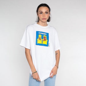 Cat Dog T-Shirt 90s Grimm Shirt Reigning Cats and Dogs Tshirt Royalty Animal Lover Graphic Tee Cartoon Top White Vintage 1990s Medium Large