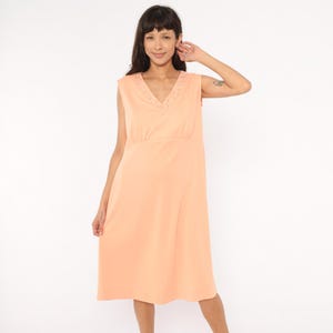 white sleeveless shirt dress Ilio Sleeveless Linen Wrap Midi Dress in White By DISSH