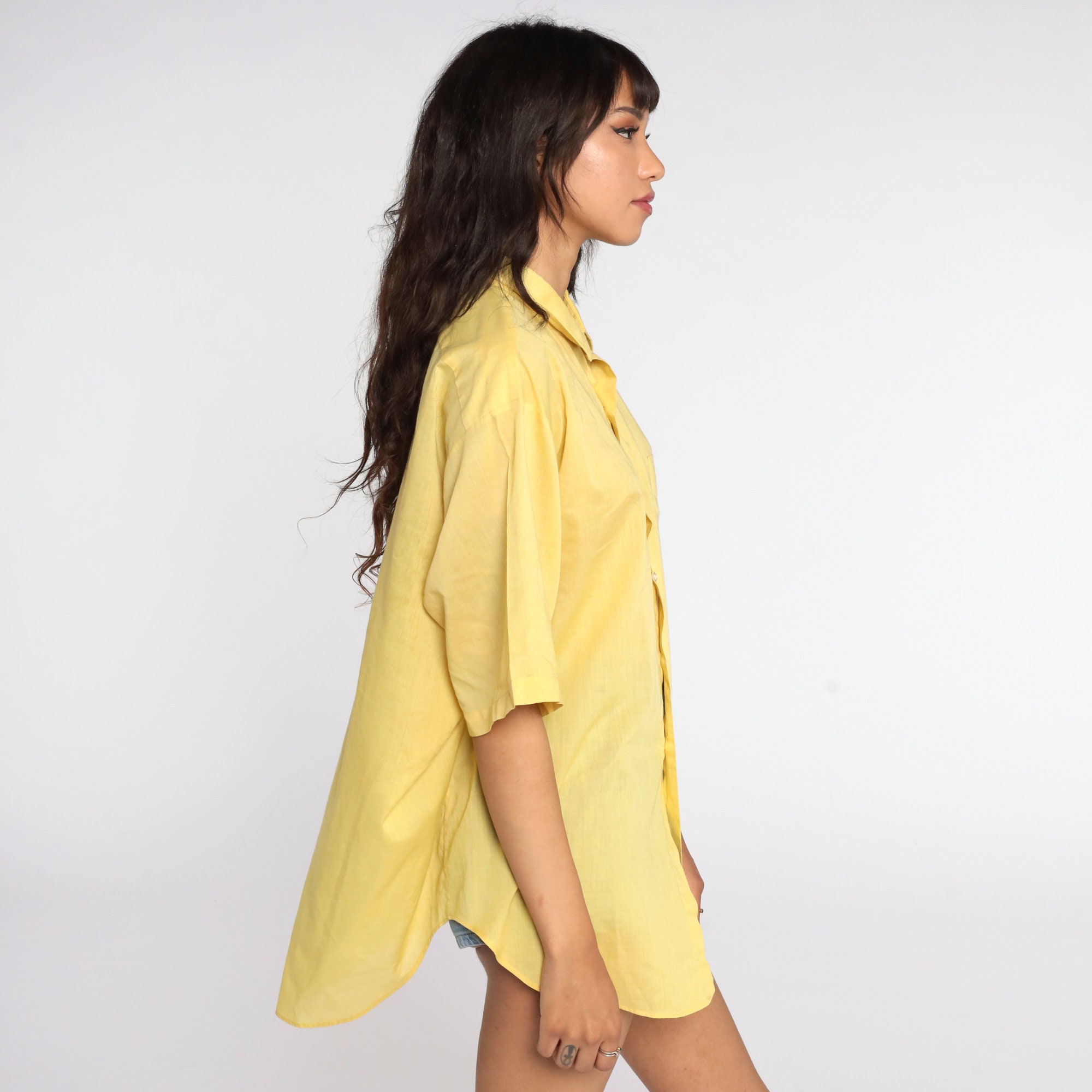 yellow button up shirt