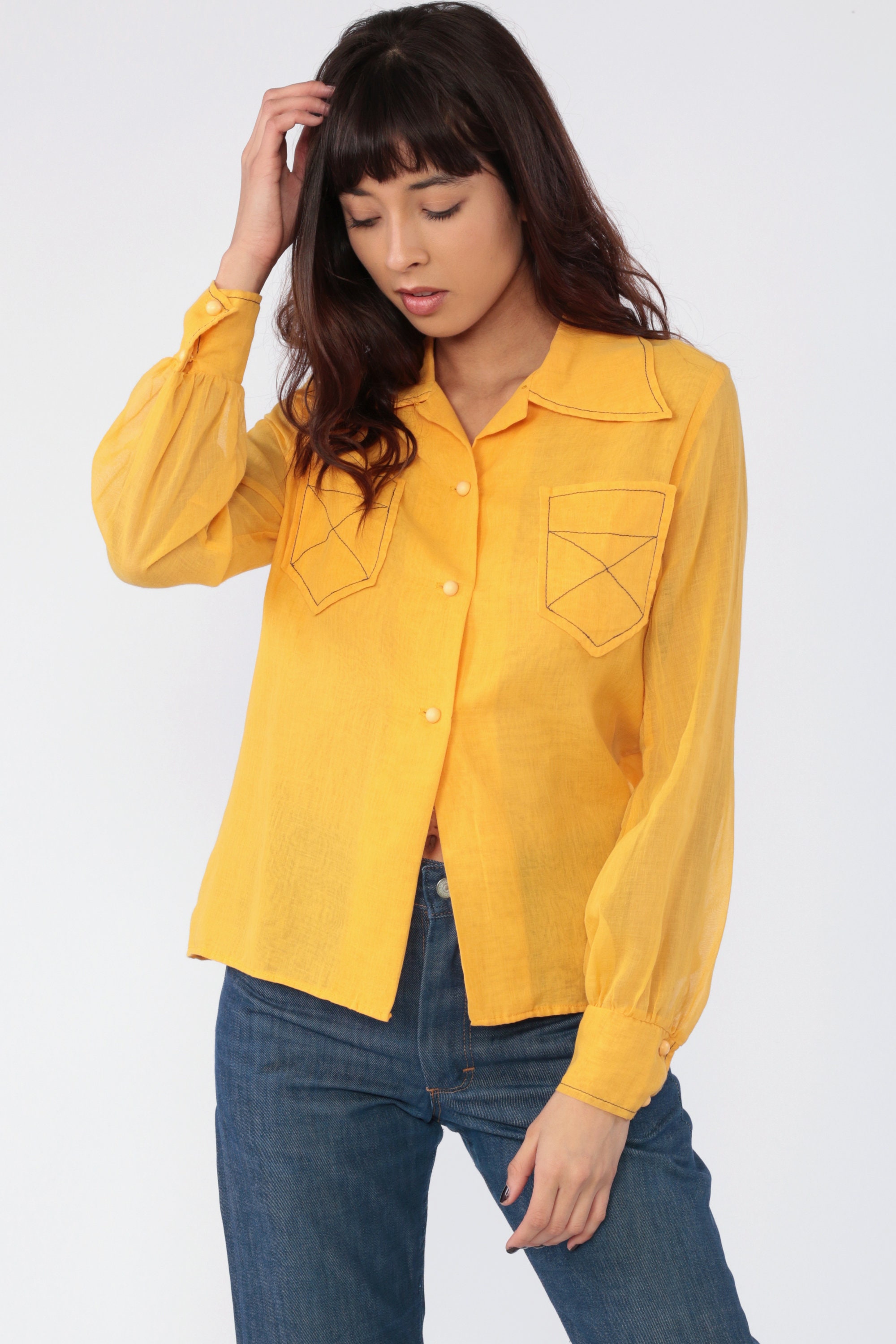 yellow button up shirt