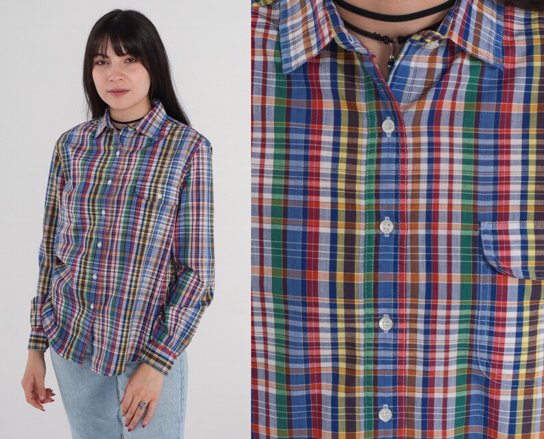 Pode incluir: Uma camisa de bot&otilde;es de manga comprida com um padr&atilde;o xadrez multicolorido. A camisa tem uma gola cl&aacute;ssica e um bolso no peito.