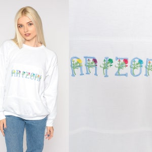 Sweat Arizona des années 80 brodé floral sweat blanc pull ras du cou fleur chemise AZ touriste manches raglan vintage des années 1980 grand L