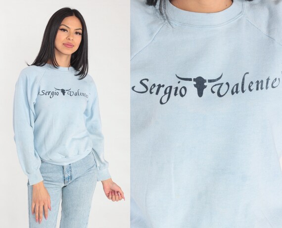 Sergio Valente Sweatshirt 90s Light Blue Raglan Sleeve Sweater Steer Skull Logo Graphic Designer Distressed Faded Vintage 1990s Medium M