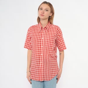 May include: A rustic wooden sign with the text "Welcome to our porch" in white lettering. The sign features a distressed finish and a simple, inviting design, perfect for outdoor decor.