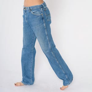 May include: A pair of light blue denim jeans with a straight leg fit.