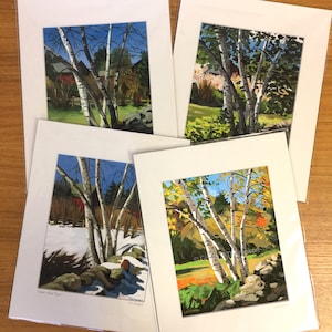 May include: Four framed paintings of birch trees in different seasons. The paintings show the trees in winter, spring, summer, and fall. The paintings are all in the same style and are all framed in white.