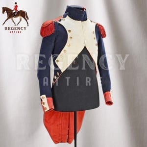 May include: A blue military jacket with white and red accents. The jacket has a high collar and gold buttons. The jacket is on a mannequin.