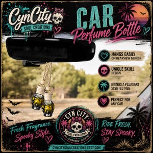 May include: Two skull-shaped glass car perfume bottles with wooden caps and jute hanging cords, suspended from a black rearview mirror. The graphic background features text including CynCity Soul Creations, Car Perfume Bottle, and Ride Fresh. Stay Spooky.