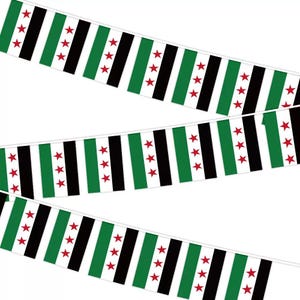 May include: A decorative bunting banner featuring a repeating pattern of the Syrian opposition flag. Each rectangular flag segment displays three horizontal stripes in green, white, and black, with three red five-pointed stars centered in the white stripe.