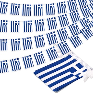 May include: A string of multiple small rectangular flags featuring the blue and white striped design of the Greek national flag. The flags are attached to a white cord, with a stack of identical loose flags positioned in the lower right corner.