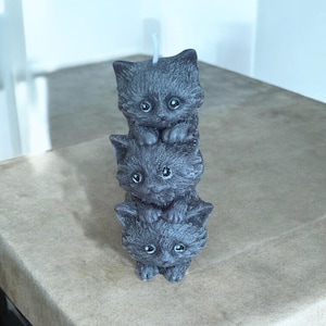 Playful cat stack pillar candle