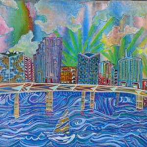 May include: A colorful painting of a cityscape with buildings in shades of blue, green, and yellow. The buildings are reflected in the water below, which is painted in shades of blue and purple. The sky is painted in shades of pink, blue, and green.