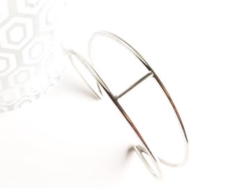 Minimalist silver cuff bracelet, modern and sculptural wire design that wears well alone or stacked with other wrist jewelry - "Vega Cuff"