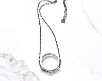 Striking silver necklace, a unique and edgy design of contrast play between charcoal chain and matted square wire circle - "Cipher Necklace"