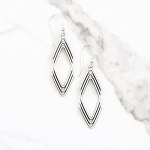Geometric dangle silver earrings in an arrowhead shape handmade of individually formed pieces of silver wire - "Arrowhead Earrings"