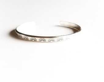 Minimalist sterling silver cuff bracelet with a repeating pattern of sunburst motifs, perfect sturdy stacking wrist jewelry - "Sunray Cuff"