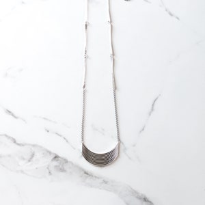 Long boho style sterling silver necklace with a unique pendant handmade by joining flattened and curved silver wires - "Tribe Necklace"