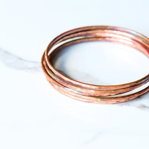 Set of five hammered copper bracelets formed and heat treated for a unique modern look and splash of fall colors - "Desert Bangles - Copper" image 6