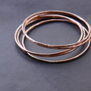 Set of five hammered copper bracelets formed and heat treated for a unique and modern look and splash of fall colors - "Desert Bangles"