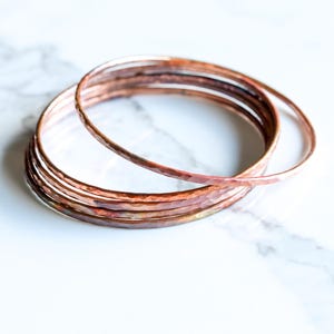 Set of five hammered copper bracelets formed and heat treated for a unique modern look and splash of fall colors - "Desert Bangles - Copper" image 3
