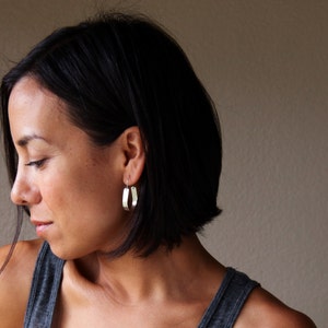 Modern sterling silver hoop earrings patterned with embossed lines and oxidized to a light charcoal finish - "Multiple Paths Earrings"