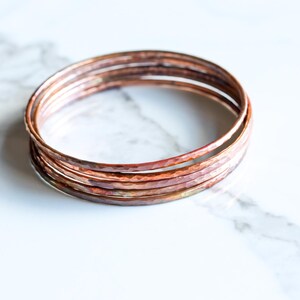 Set of five hammered copper bracelets formed and heat treated for a unique modern look and splash of fall colors - "Desert Bangles - Copper" image 4