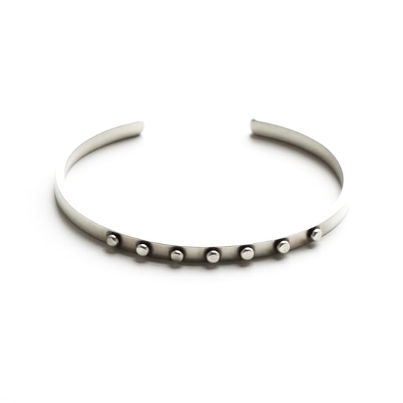Edgy silver cuff bracelet handmade of rectangular silver wire and embellished with seven flattened silver balls - "Union Cuff"