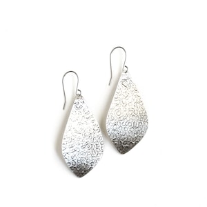 Handmade sterling silver earrings with a streamlined yet unique outer leaf shape and a distinctive hammered pattern - "La Hoja Earrings"