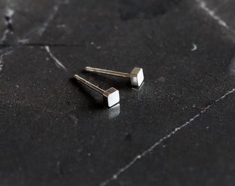 Tiny silver post earrings with a modern square shape, perfect for multiple piercings and curated earscape look - "Square Dot Studs - Silver"