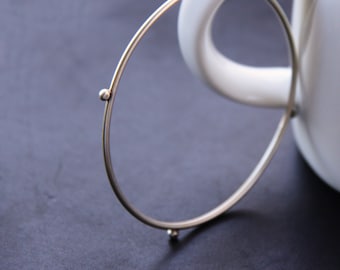 Modern silver bangle bracelet formed and forged of thick silver wire and accented with silver balls, perfect for stacking - "Compass Bangle"