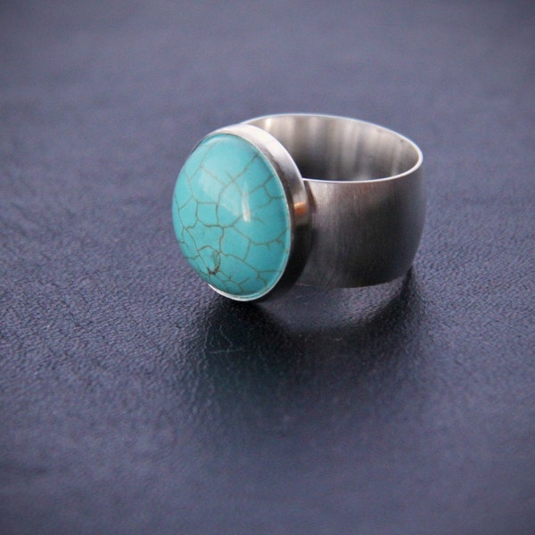 Modern turquoise ring showcasing a gorgeous round bright blue stone on a sleek low-dome silver band - "Turquoise Burst Ring"